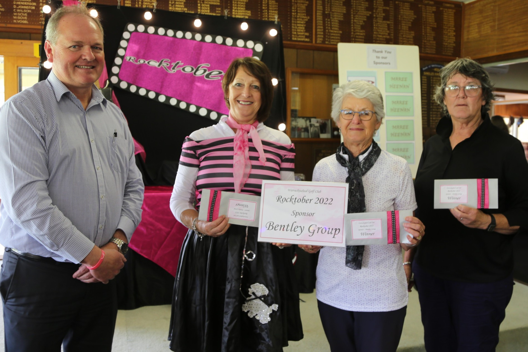 WINNINGS: (L to R) Rocktober event sponsor representative, Allirstair Lawson, presents winner's prizes to winning team players Vicki Hinkley, Isobel Davison and Marlene Pilmore. Photo: CONTRIBUTED