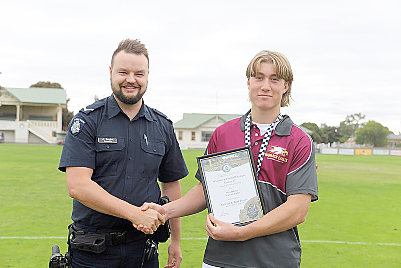 Max Inkster received his Spirit of Football Award from Warracknabeal's First Constable Jake Goebel before the game at Anzac Park on Saturday.