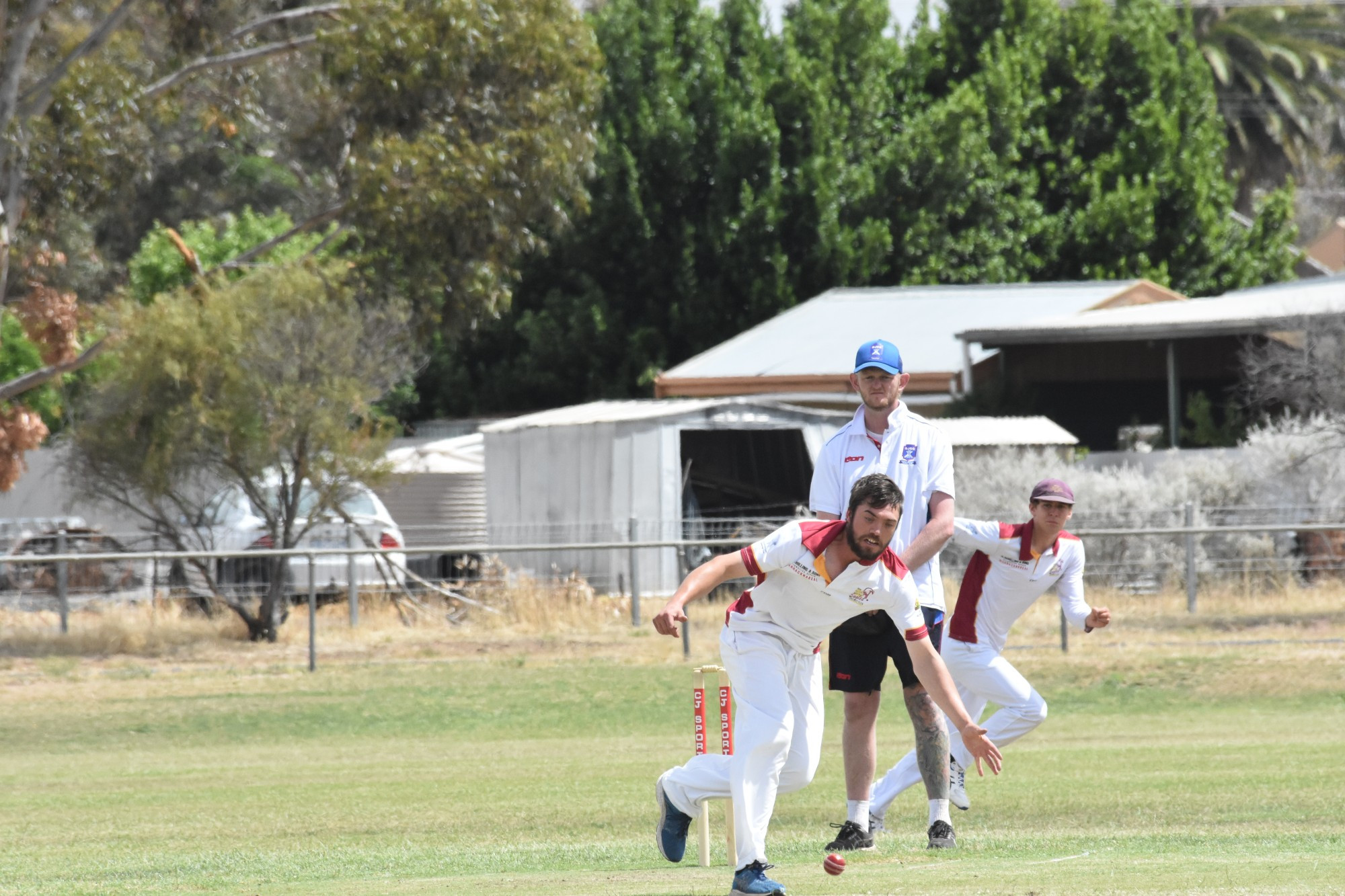 Royce Bennett (Brim-KSH) backs up his bowling to prevent a single.