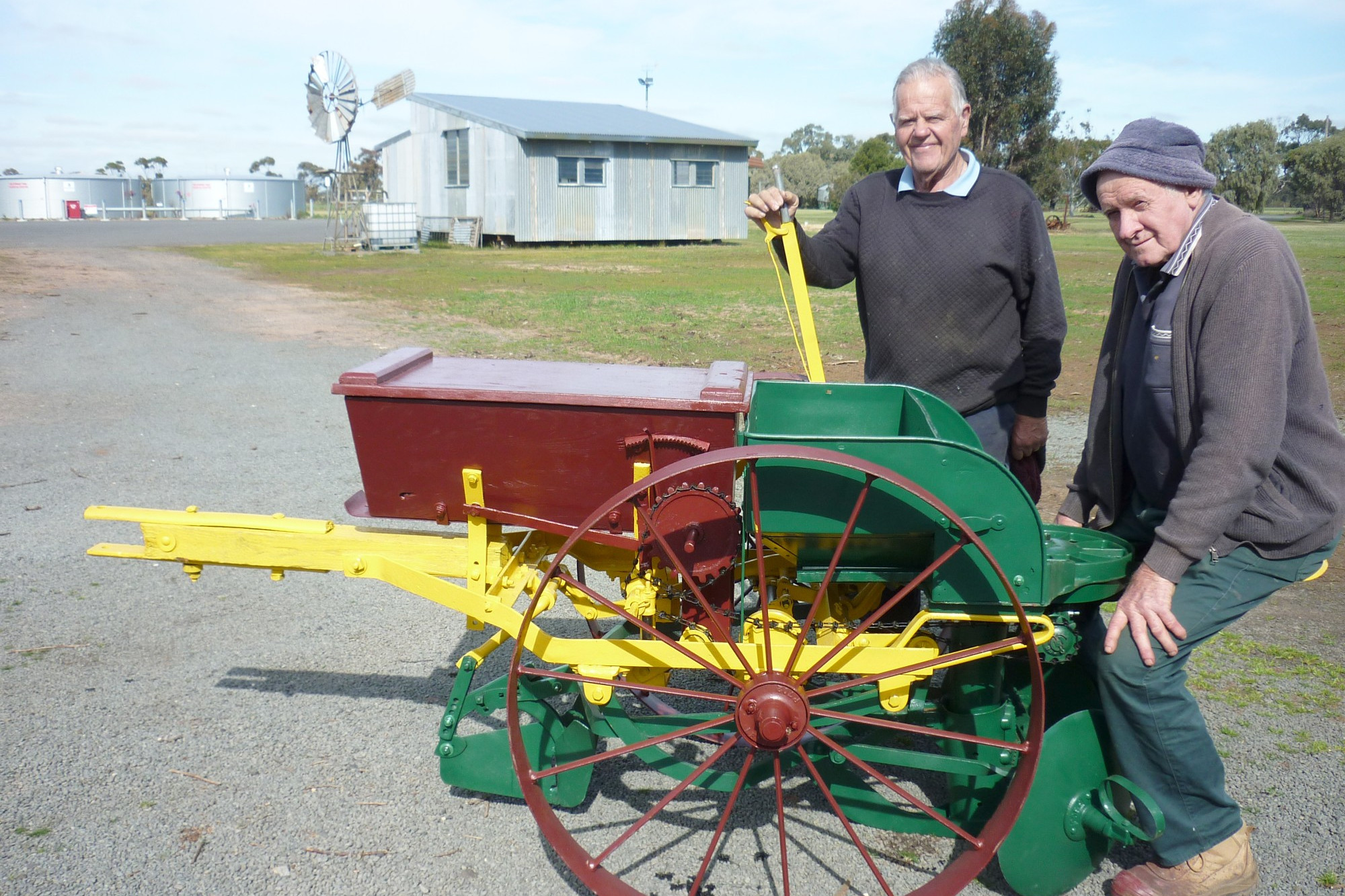 Graeme Werner and Gordon Mills take the newly-restored potato planter for a trial run.