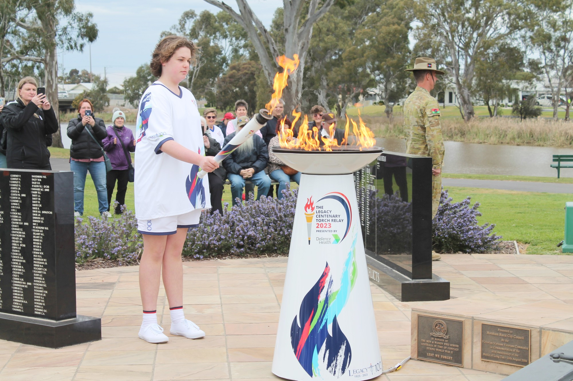 Horsham's Cory Hallam Brook, 15, lights the cauldron.
