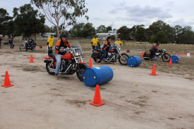 FRIENDLY COMPETITION: OxHog Chapter riders and husband and wife duo Dez and Lyn Boyd compete in the barrel racing at the Victorian Harley Owners Group Breakfree State Rally. Photo: ABBY WALTER. 