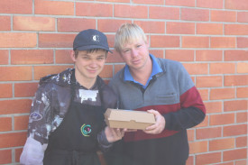 SUPPORTING OTHERS: Members of the Uniting Wimmera disability program Marc and Glenn pack boxes of pancakes ready for the team to deliver to Horsham businesses. Photo: ABBY WALTER. 