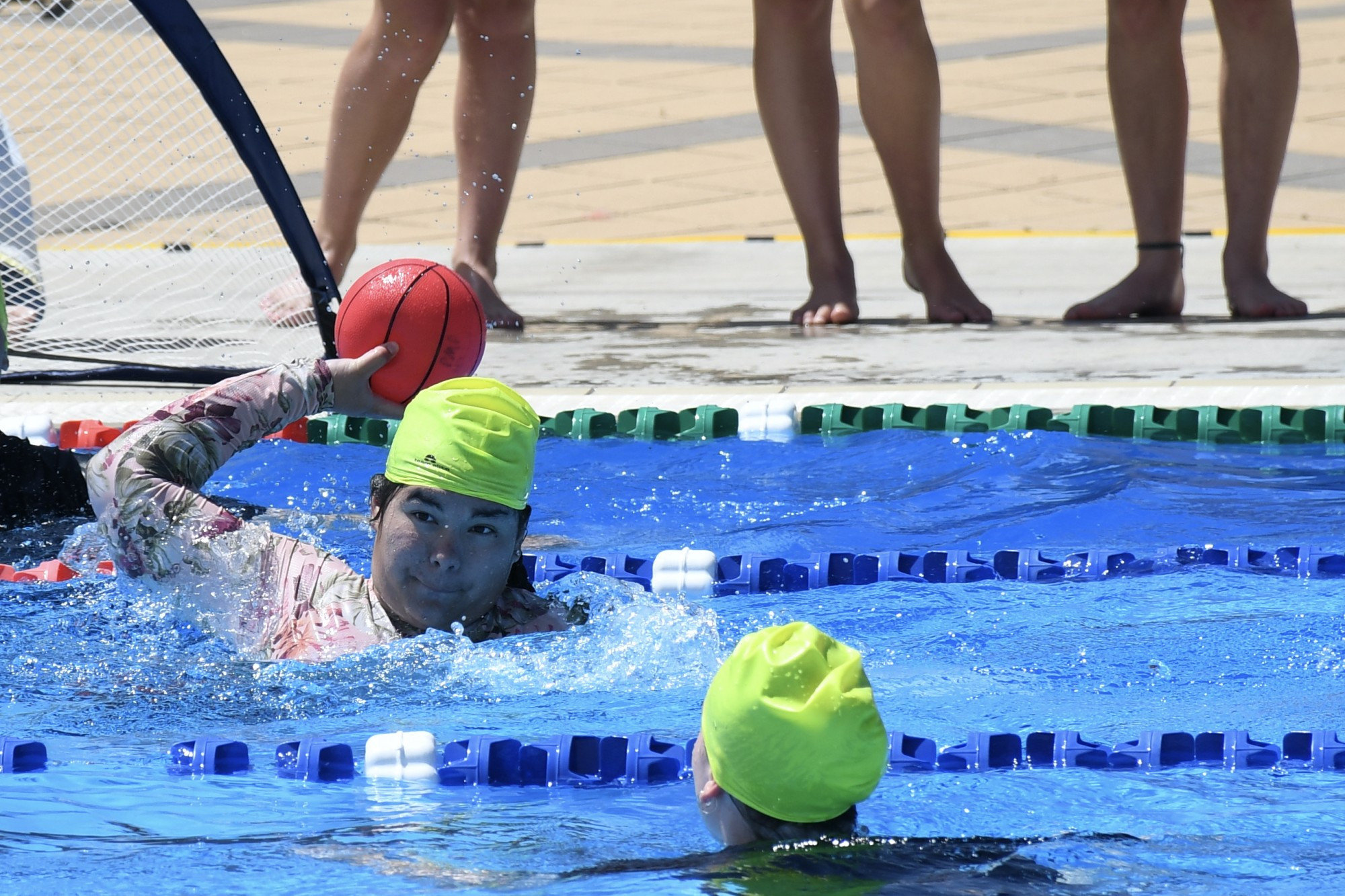 GAMES: Cher-Leah Williams aims for a long throw in the senior water polo game at the swimming sports. Photo: ABBY WALTER.