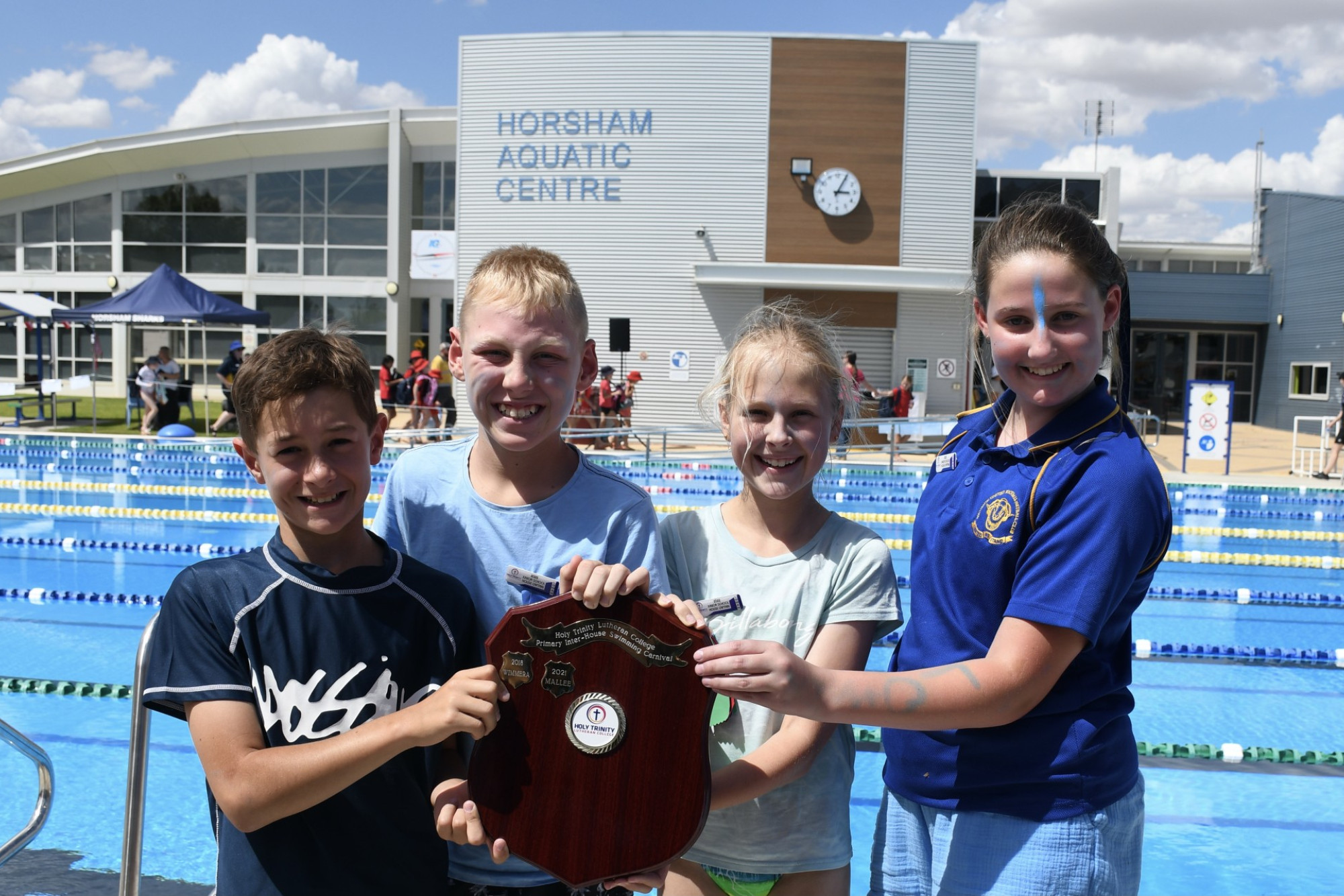 WINNING HOUSE: Lowan sports captains Lj Kafegellis, Bailey Dridan, Grace Puls and Violet Mason celebrate after a competitive day of swimming and team novelty games. Photo: ABBY WALTER.