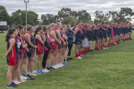 Laharum line up for a minutes silence.