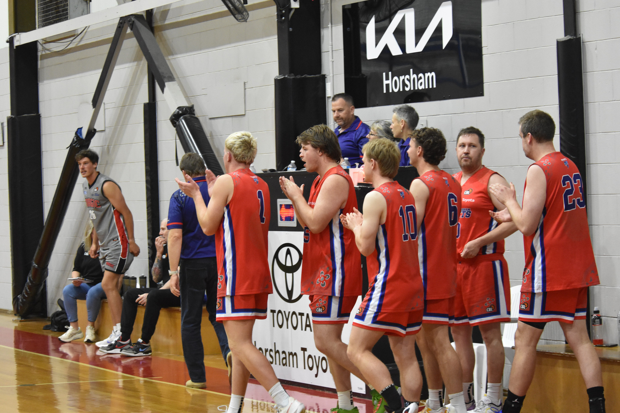 The players celebrate their win. PHOTO: CHRIS GRAETZ