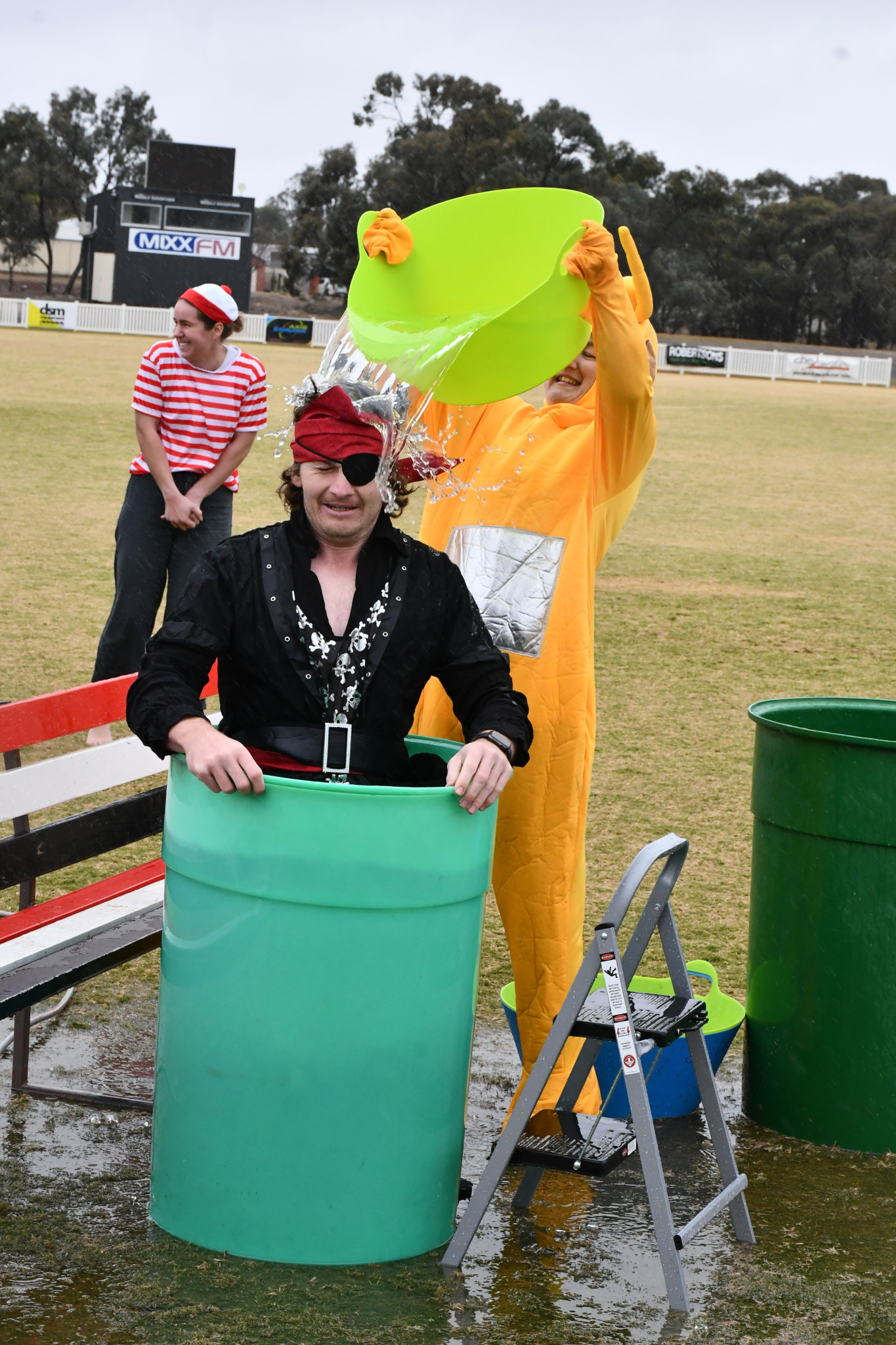 Ashlee Grace helping George Walker complete the challenge.