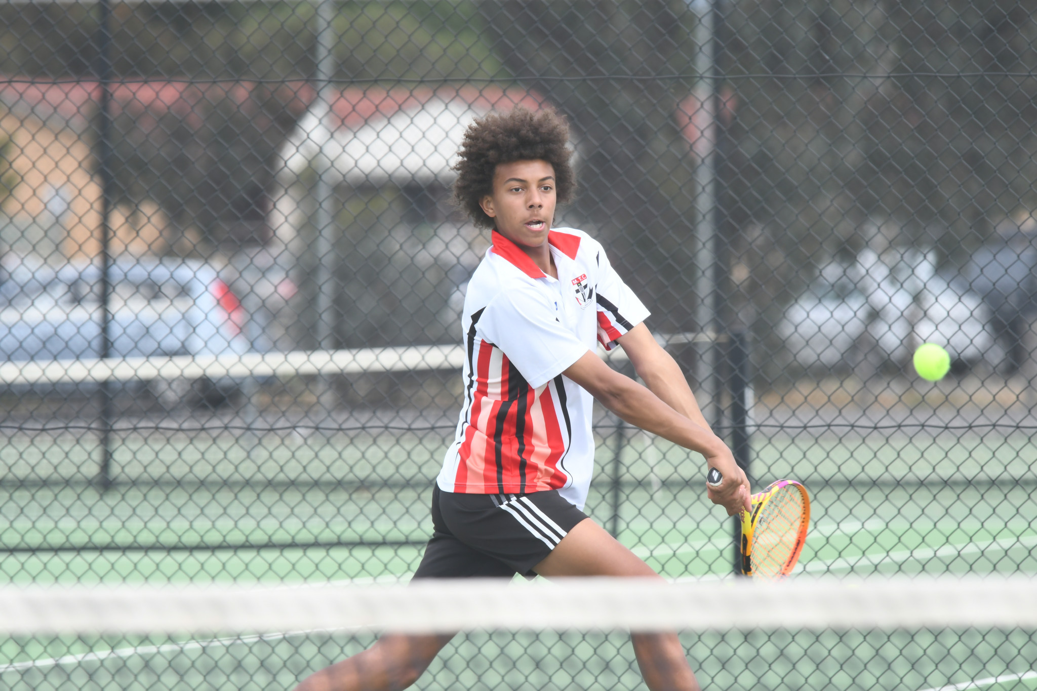Eli Bailey (St Michaels) eyes the ball ahead of a backhand return.