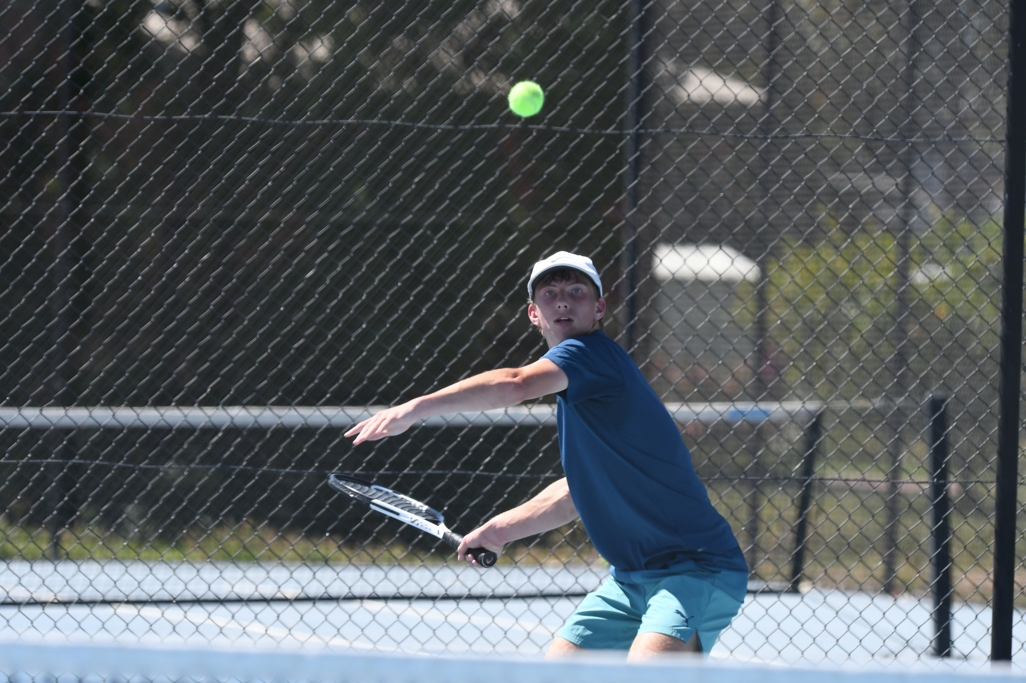 Horsham Lawn’s August Koch tracks the ball during a rally against Eli Bailey.