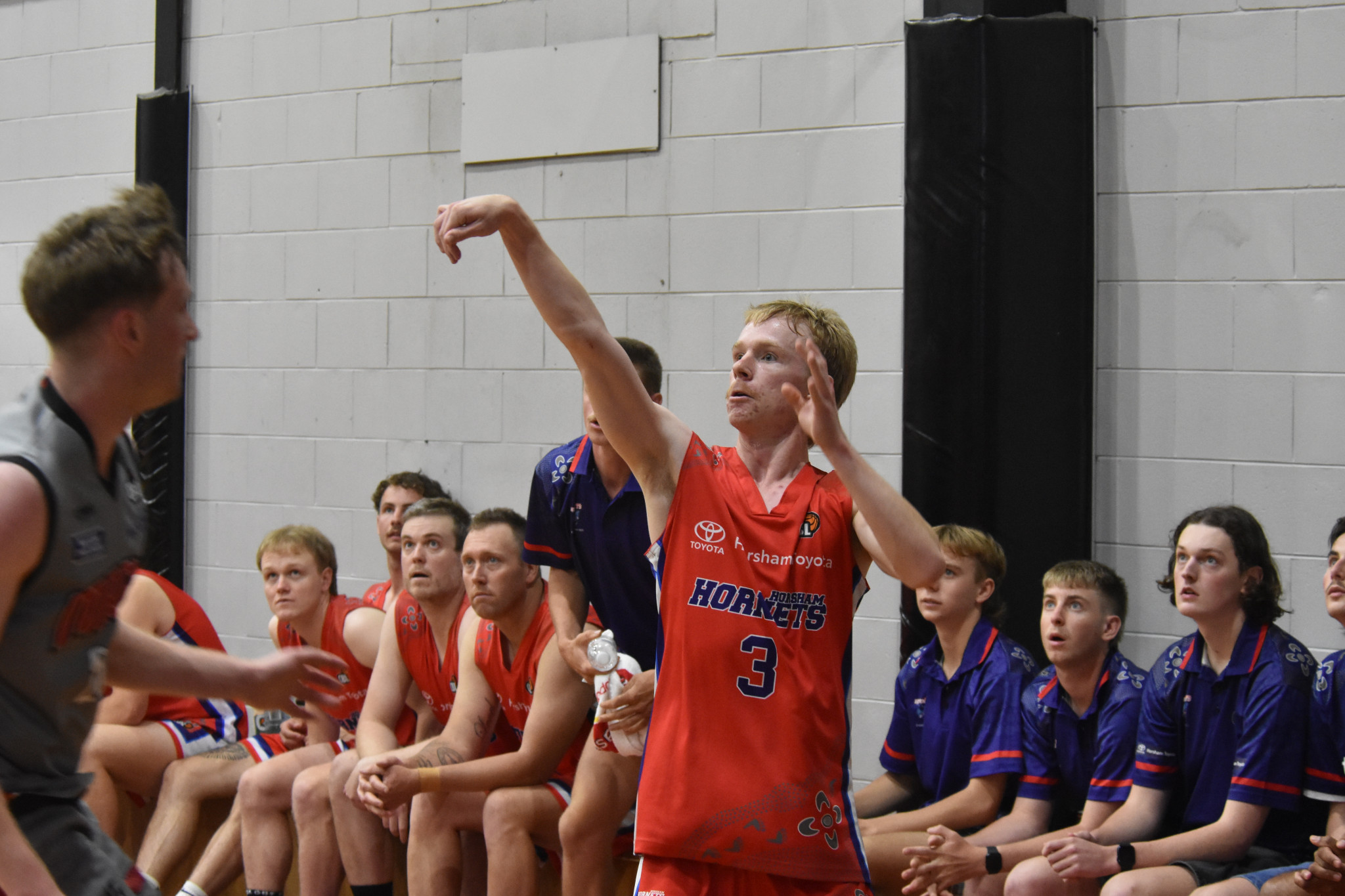 Hornets Freddy Frew nails this three-pointer with scores 75-73 with under two minutes to go. PHOTO: CHRIS GRAETZ