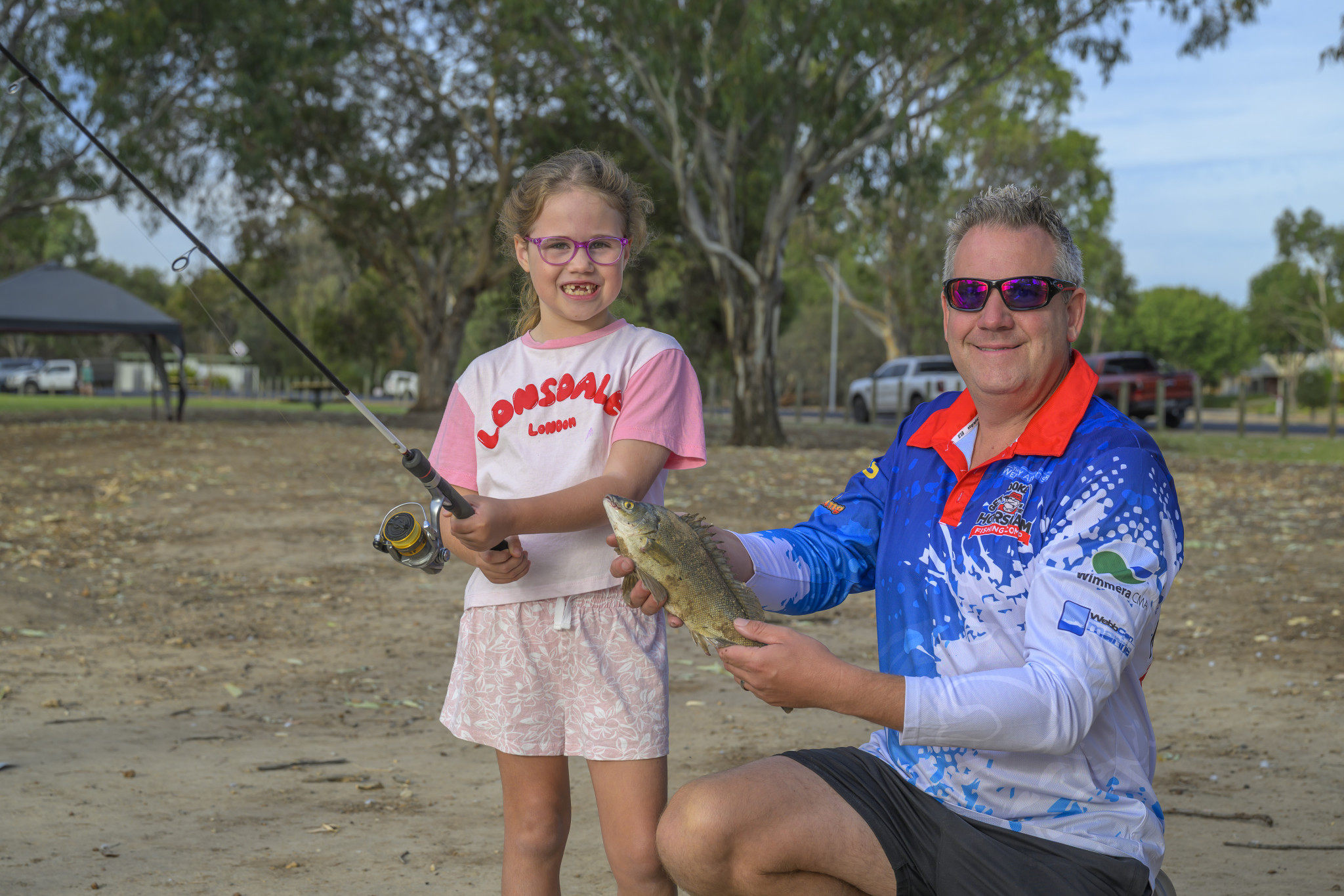 Emily Morson (left) with Curtis Morson holding a silver Perch that Emily caught. Photo: ROBIN WEBB