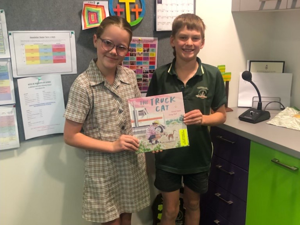 Letty R and Ned P pictured with a book during the simultaneous story time.