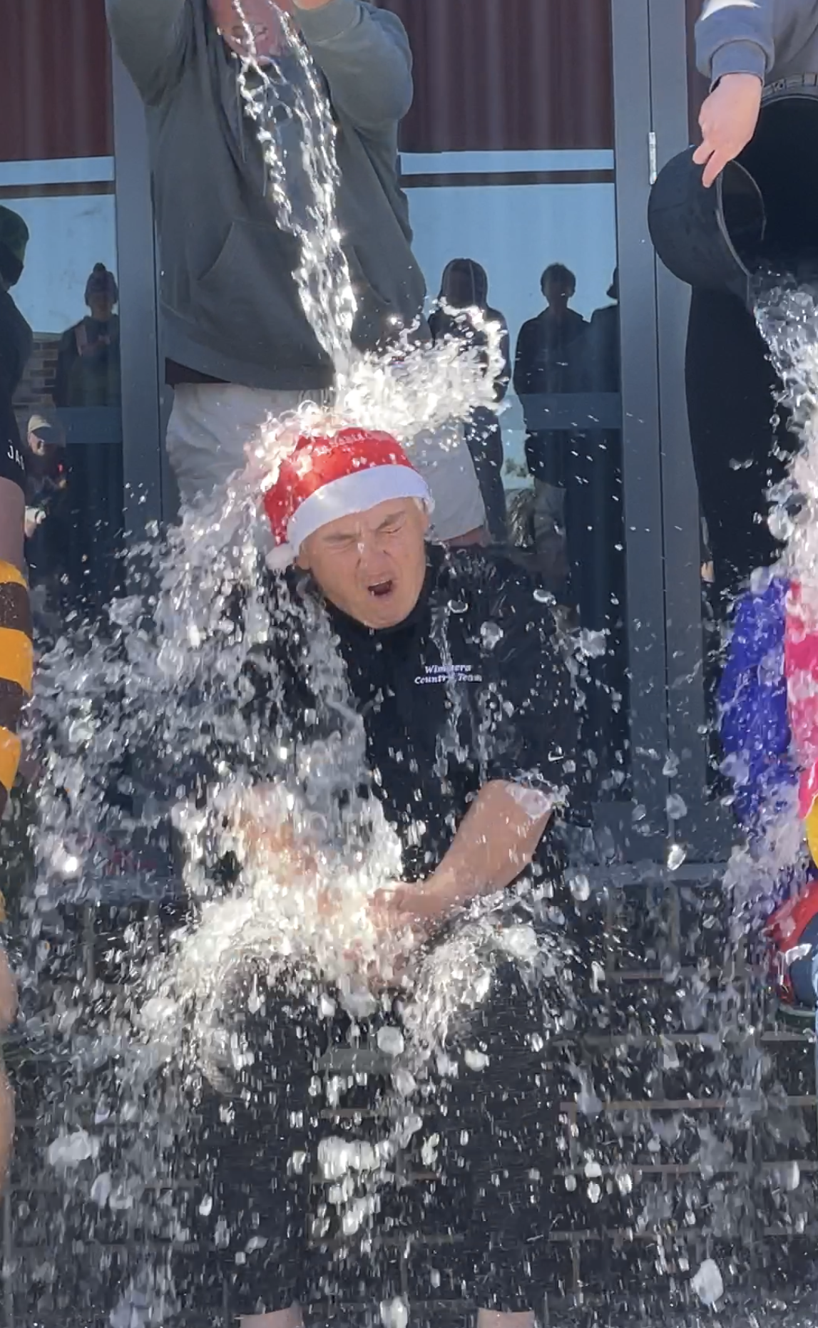 WSC principal Casey Phelan gets icy cold water dunked on her. PHOTO: CAITLIN MENADUE