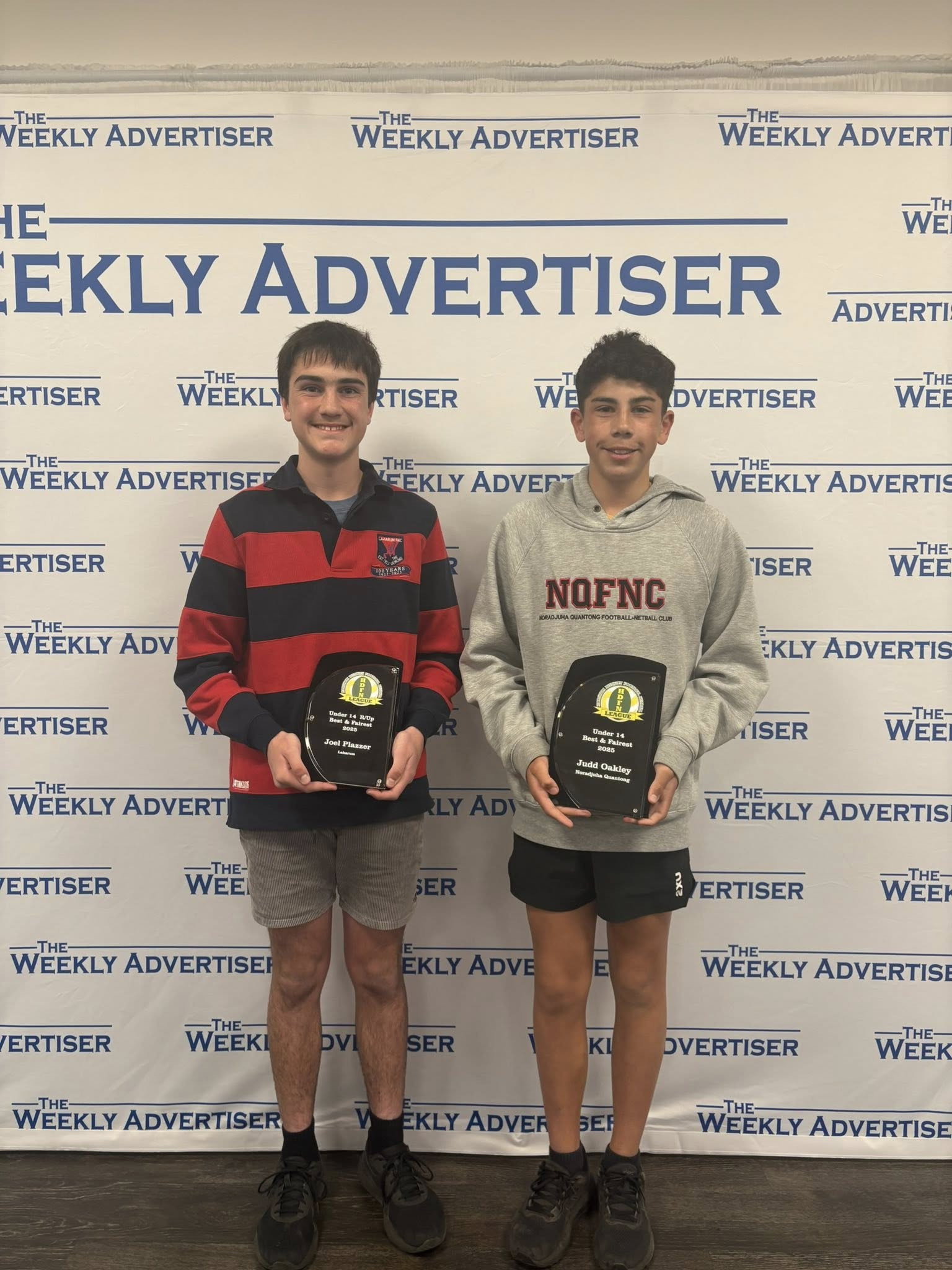 Laharum’s Joel Plazzer and Noradjuha Quantong’s Judd Oakley with their respective under 14s football runner-up and best and fairest awards.