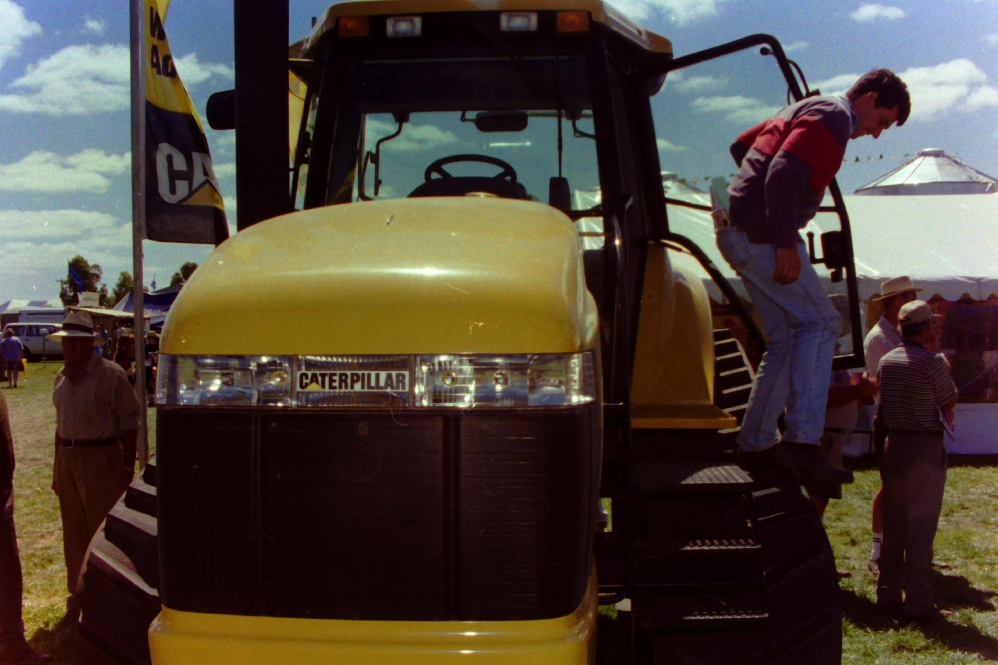 A patron steps out of machinery on display during the 1997 Wimmera Machinery Field Days. Picture file