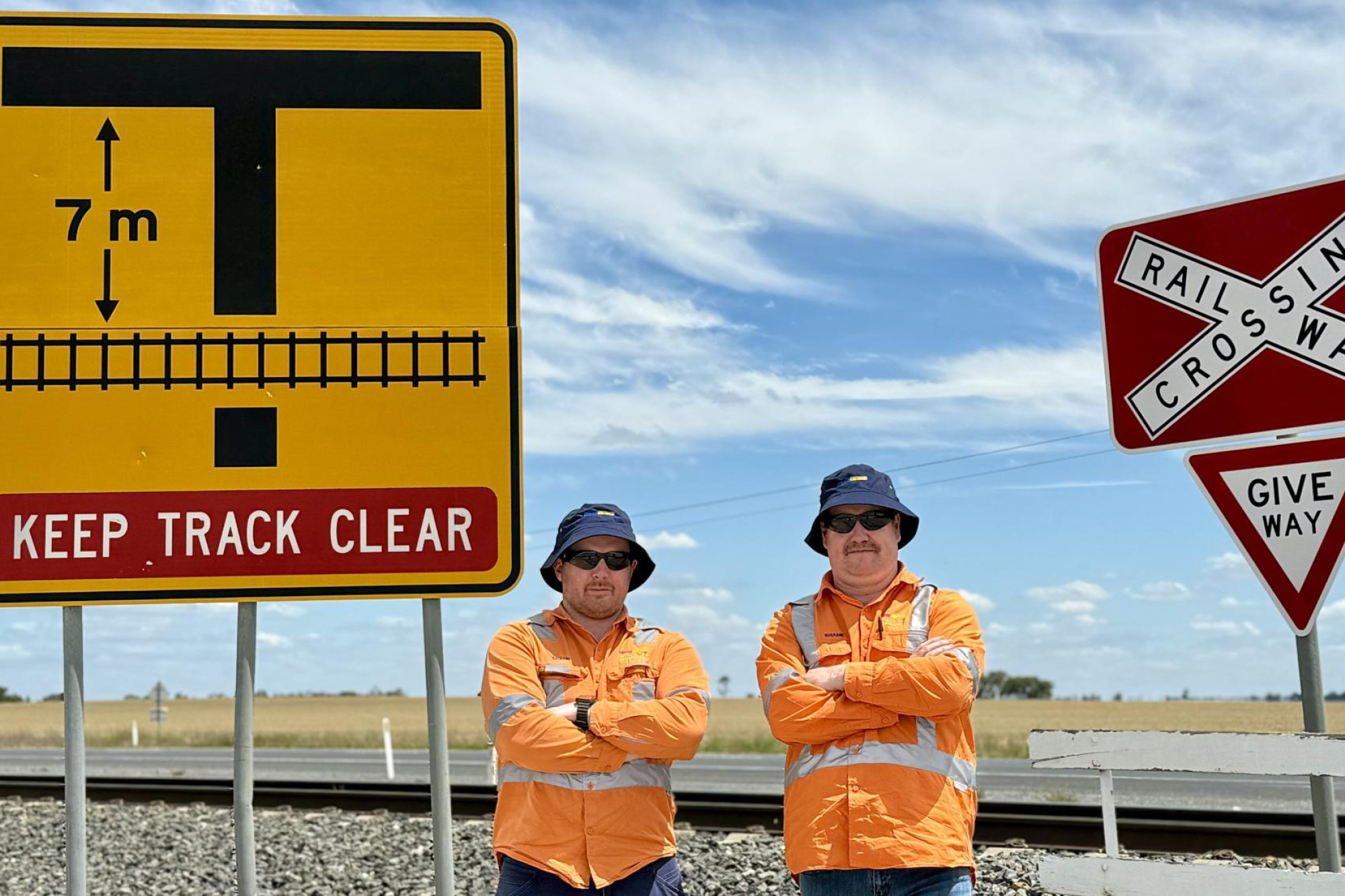 Pacific National's Shaun Cox, left and Shane Fry are hoping motorists, especially grain truck drivers, think twice before crossing a railway line after several near misses. Picture by Ben Fraser