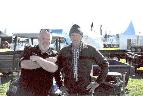 Michael Ellard from Monaghan Truck and Trailer Sales in Melbourne discusses his wares with Port Pirie farmer Thomas Ferme, back in 2022. Mr Ferme said that it was the third time he had attended the Mallee Machinery Field Days, and that he was always keen to come across the border and see what was new in farming and agriculture. Photo: SAMANTHA SMITH