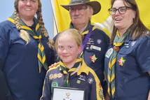 Adalyn with her Scout and Cub leaders celebrating her Grey Wolf Award.