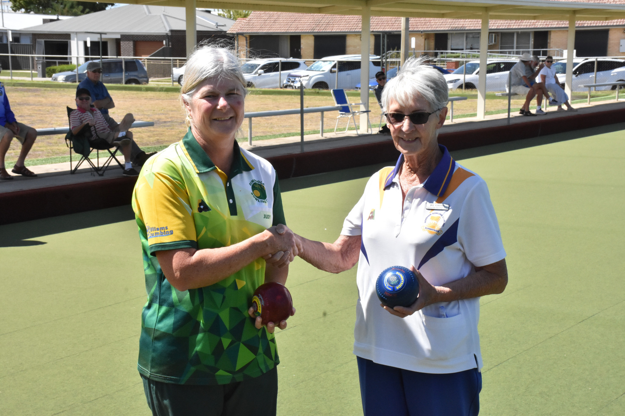 Winner Judith Albrecht and runner-up Jillian Coutts shake hands following their match. PHOTO: CHRIS GRAETZ