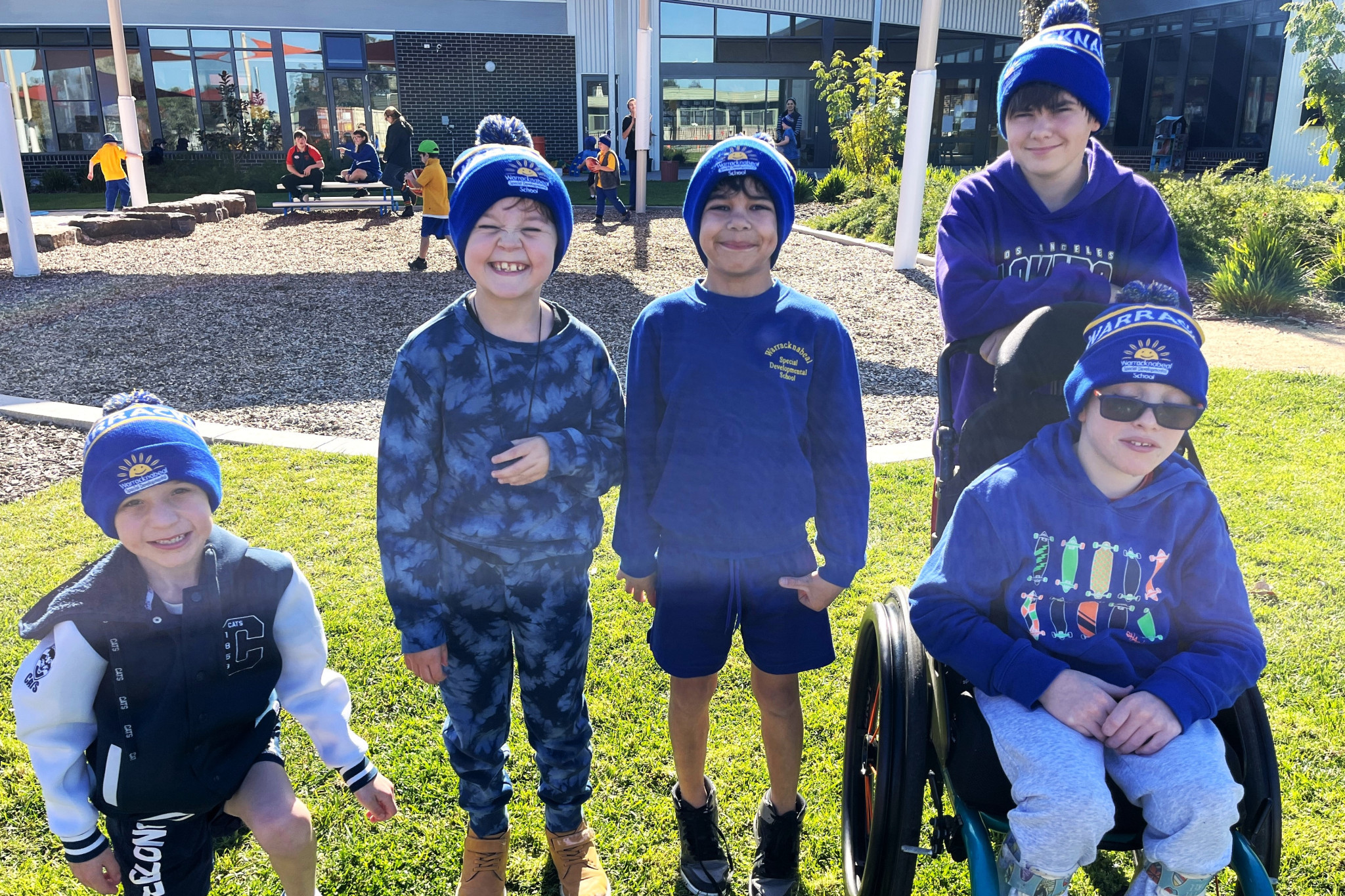 Warracknabeal Special Developmental School students James, Jamie, Xavier, Finley and Jesse proudly wearing the new school beanies as they go blue for Dolly. Photos: WSDS