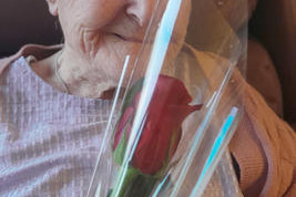 Dorothy ‘Doss’ Chenoweth receives her red rose.