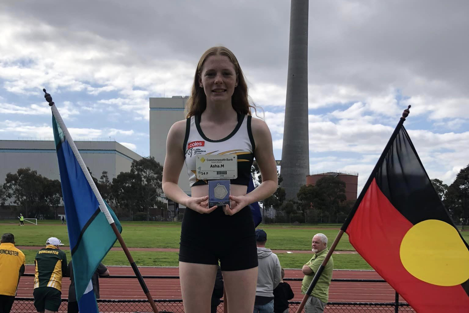 Meek on the podium with her medal.