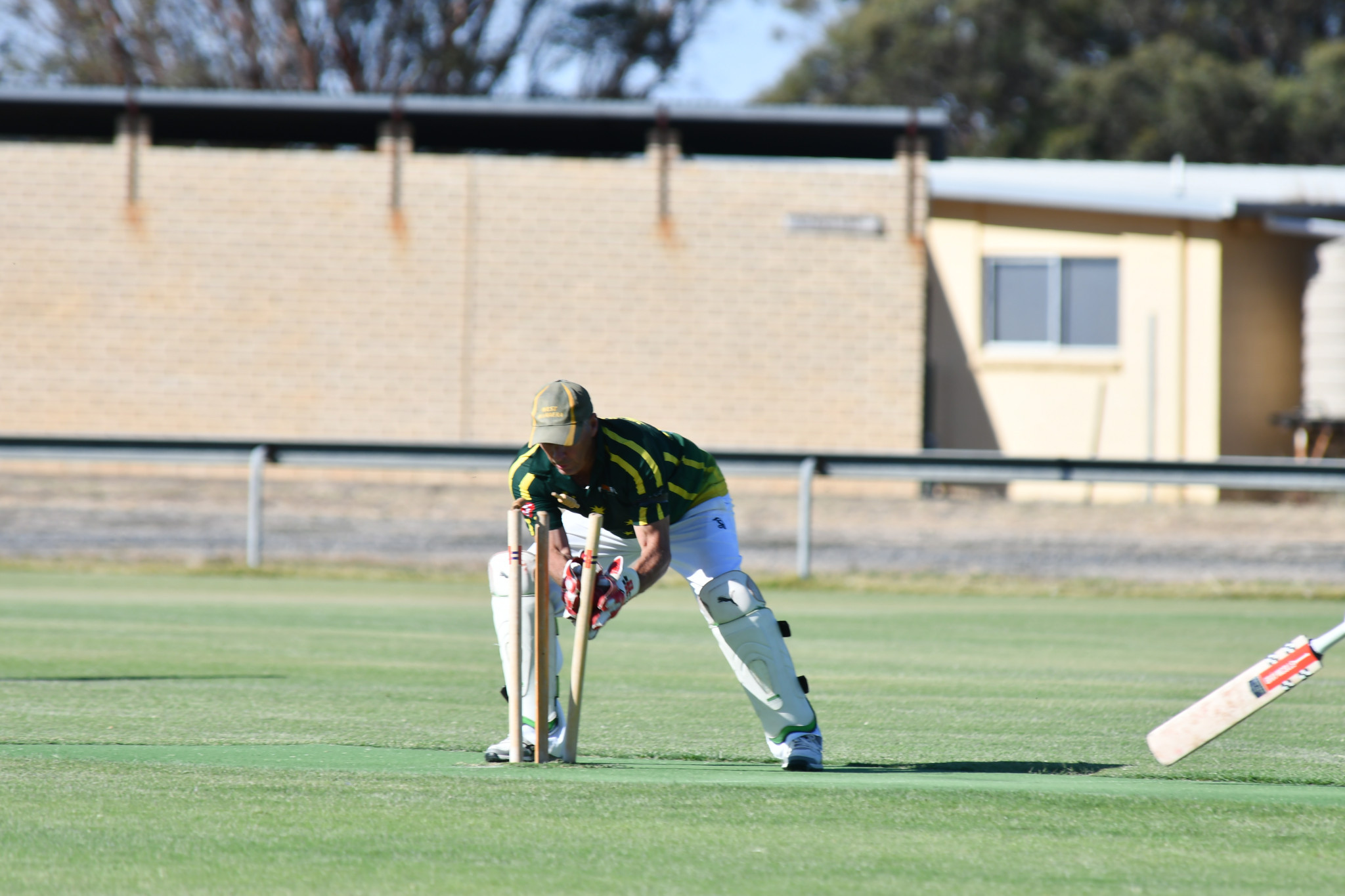 West Wimmera Warriors' wicket-keeper Ashley Dickinson gets a bullet from Tim Braendler to run out Tim Hofmaier for a diamond duck. PHOTO: CHRIS GRAETZ