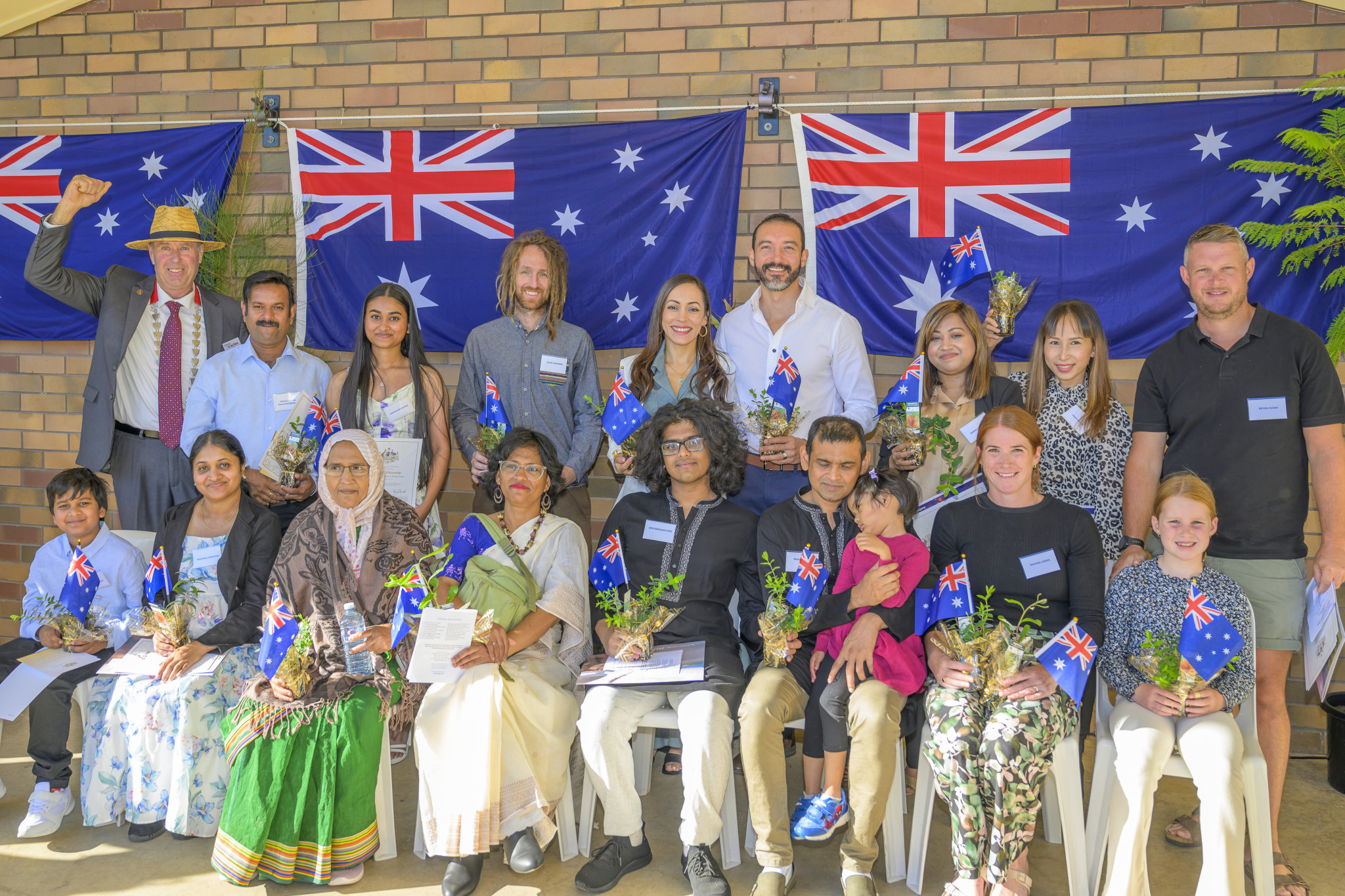 Seventeen new Australian citizens were welcomed into the Horsham community by mayor Ian Ross (standing, left). Photo: ROBIN WEBB