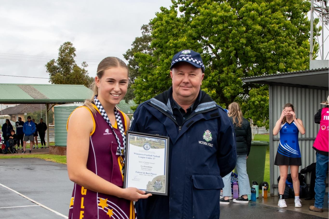 Ava Koschitzke photographed receiving her award from Beulah Police Officer Leading Senior Constable Shayne Riggall.