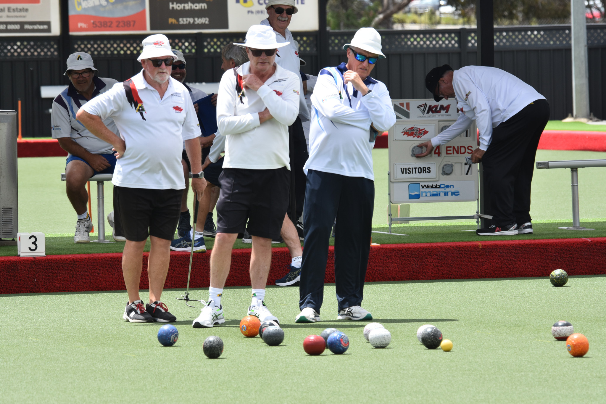 Coughlin Park and Horsham Golf bowlers watch a close end.