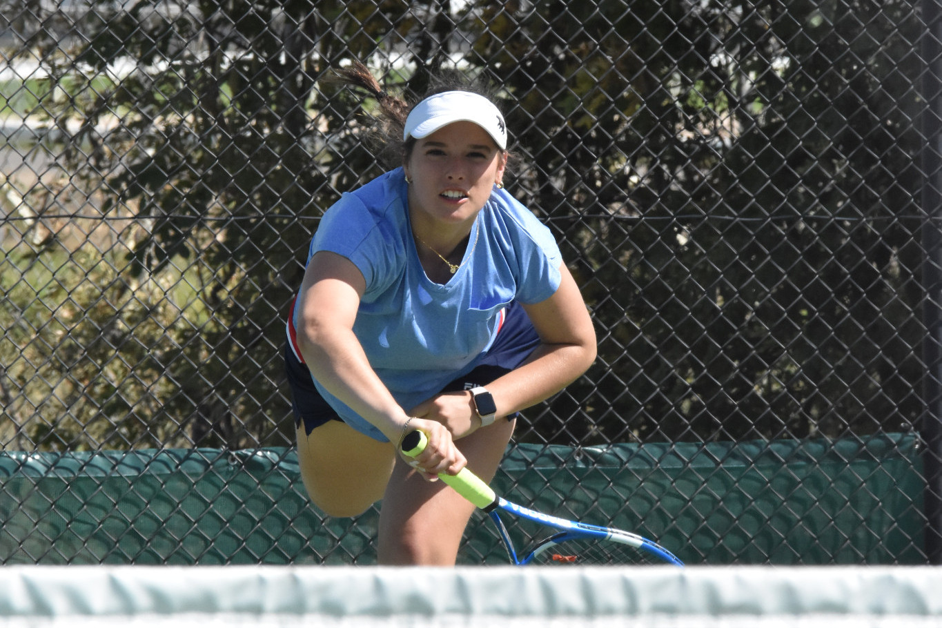 Kalkee's Charlie Friberg serves during a doubles match.