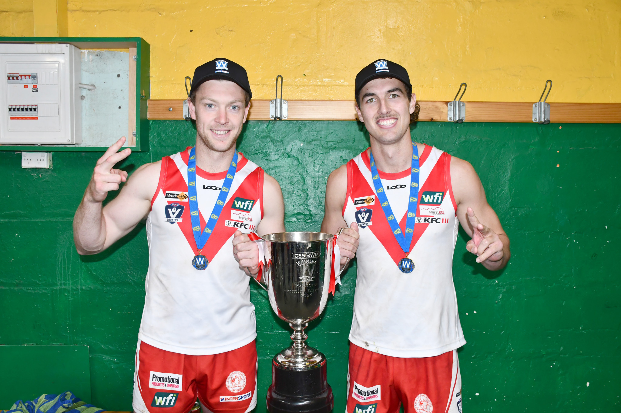 Tom Mills and Tom Williamson celebrate their first premiership as coaches.