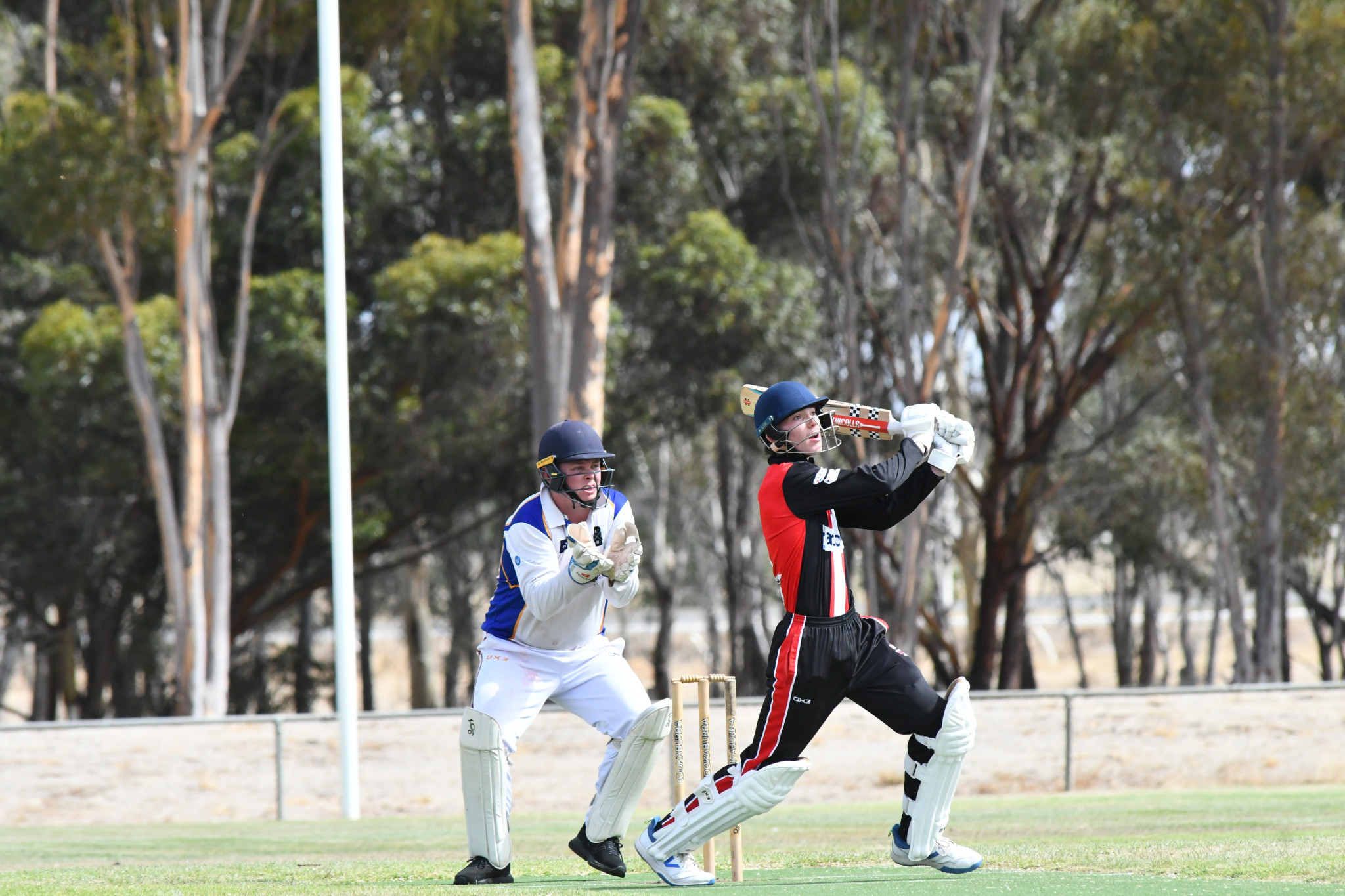 Dezi Carter brings up his century with a four. PHOTO: CHRIS GRAETZ