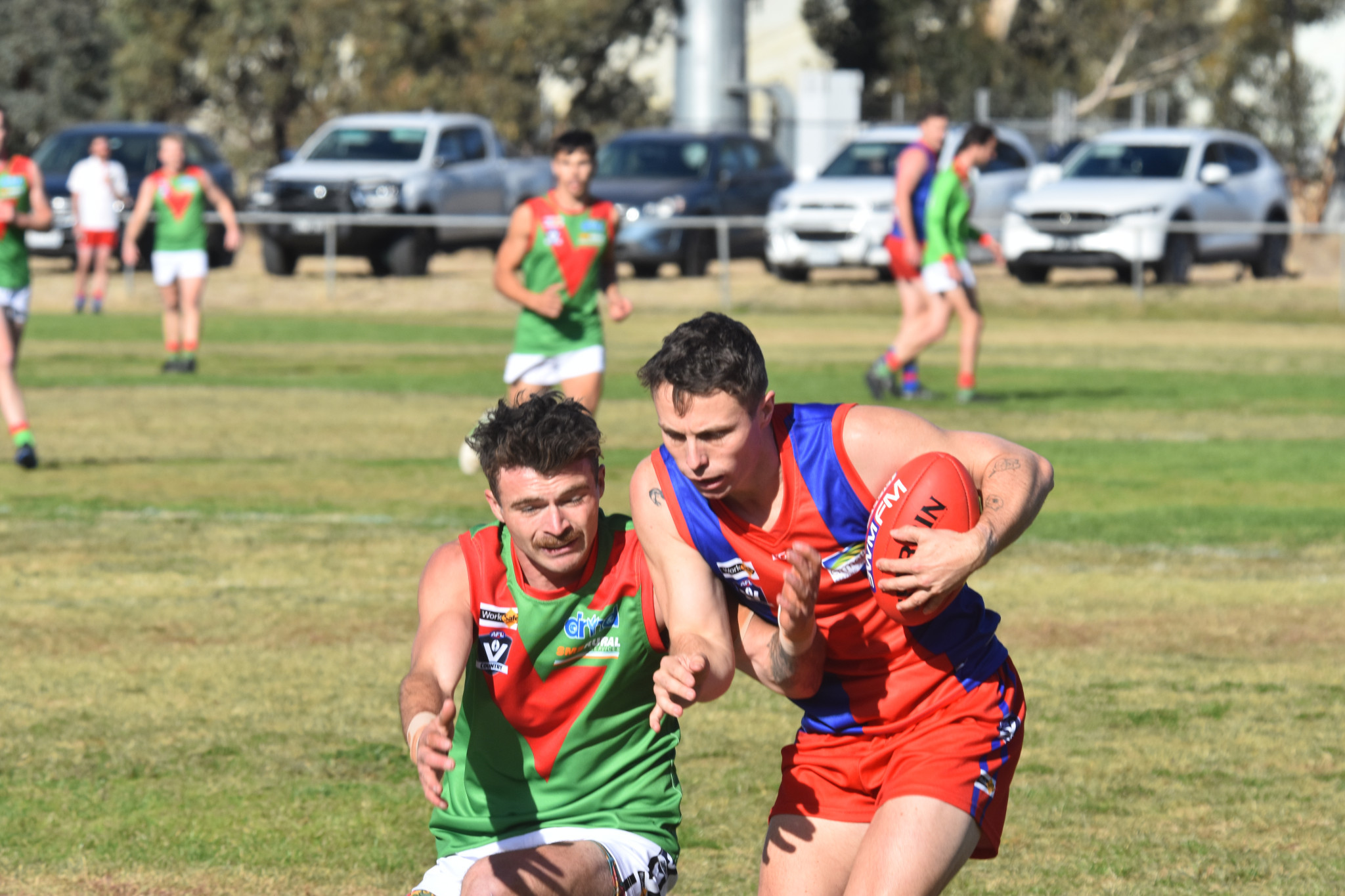 Hansen battles for the ball against Noradjuha Quantong. PHOTO: CHRIS GRAETZ