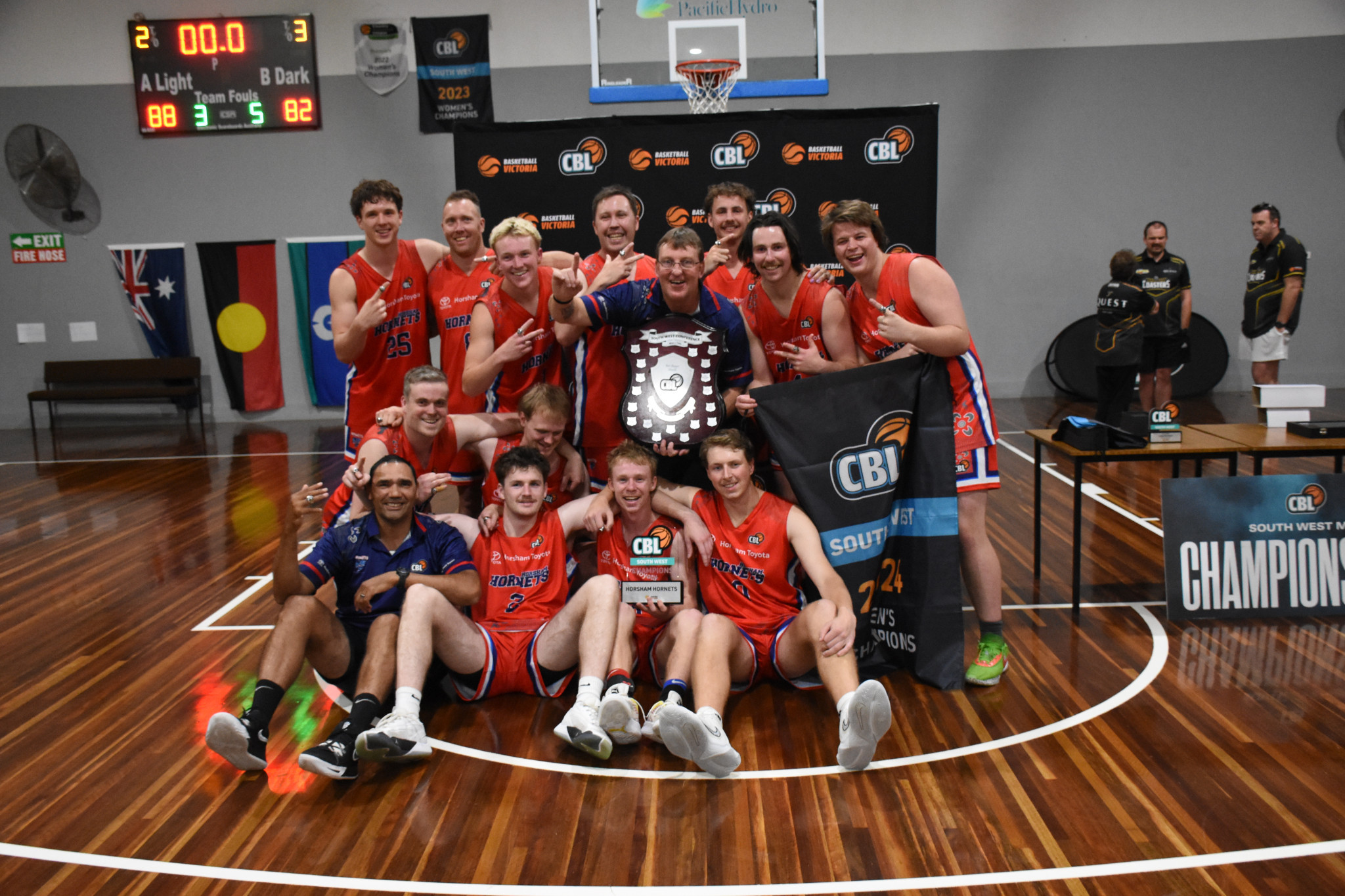 The Hornets celebrate. Back row L-R: Micah Livingstone, Jono Lovel, Tarkyn Benbow, Matt Lovel, Scott Benbow, Charlie Campbell, Mitch Martin, Hugh Dougherty. Second row: Jake Hobbs, Ryan Pfitzner Front row: Damien Skurrie, Austin McKenzie, Fred Frew, Cody Bryan.