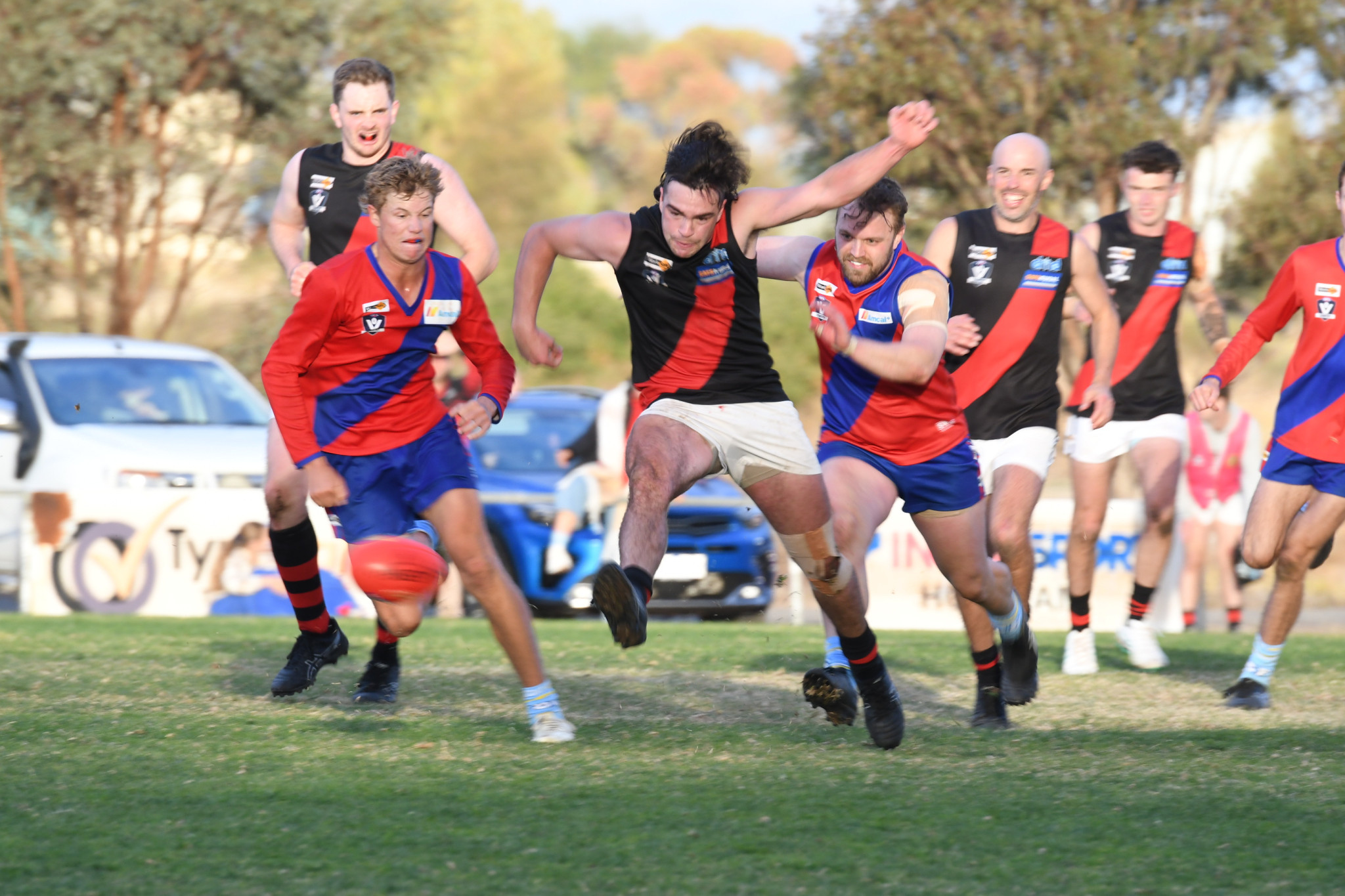 Bombers' James Hallett gets a kick away under pressure late in the fourth quarter. PHOTO: CHRIS GRAETZ