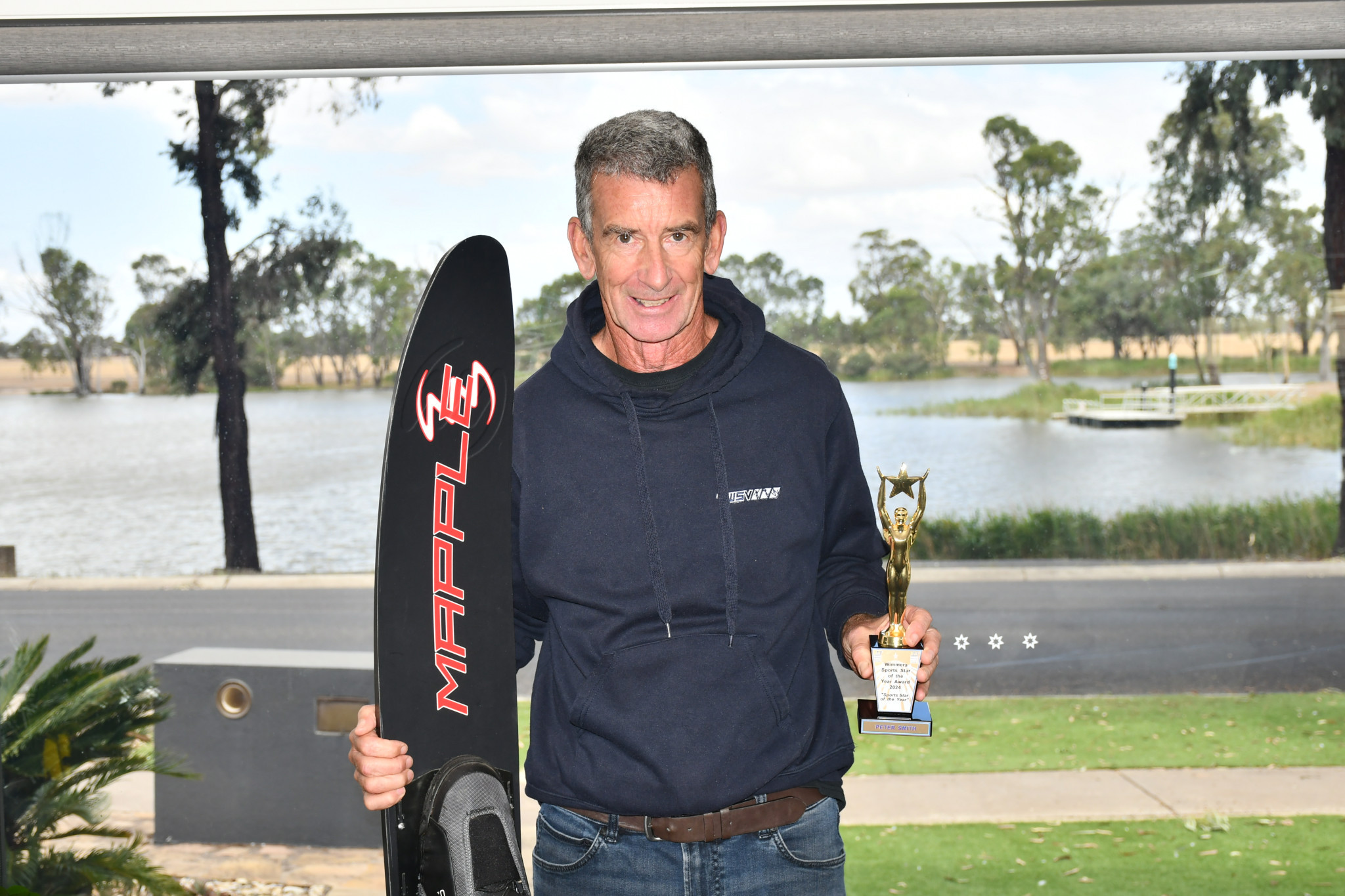 Peter Smith proudly shows off his trophy. PHOTO: CHRIS GRAETZ