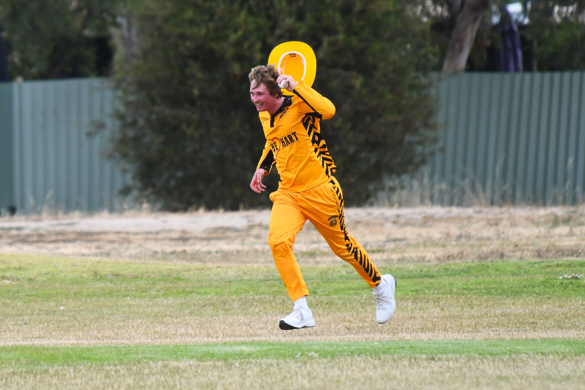 Horsham Tigers' Chris Eagle runs to celebrate with teammates after taking an outfield catch. Photos by MACKENZIE BOOK