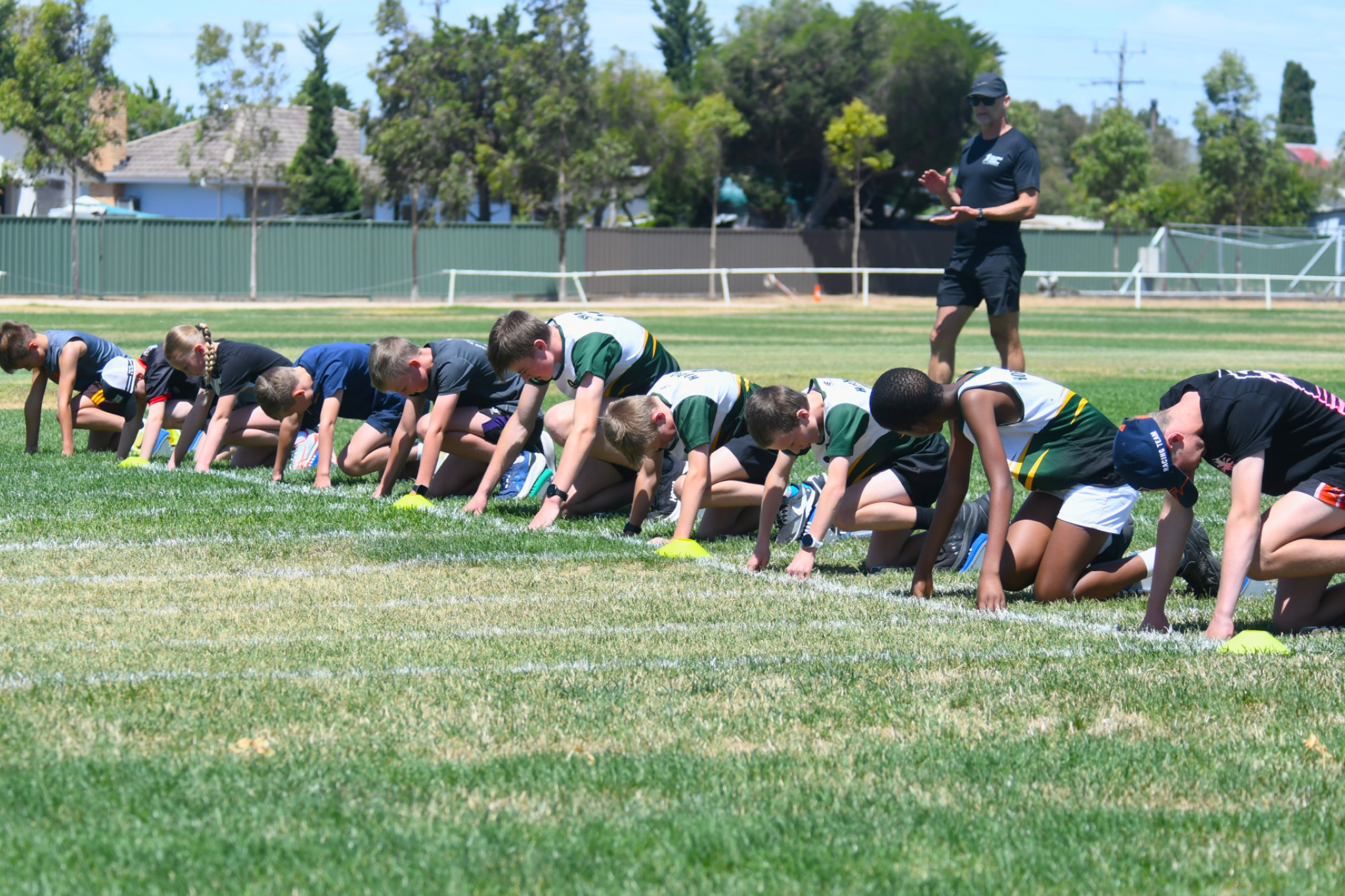 Ballarat Sprint Academy coach Conrad Oberholzer watches over Horsham Little Athletics athletes during a session at Dudley Cornell Park.