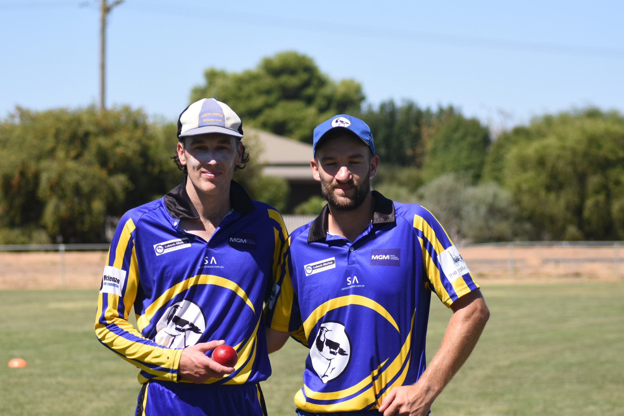 Mudlark's captain Shannon Reddie (right) with Nic Ballagh with the ball he got the five wicket haul with.