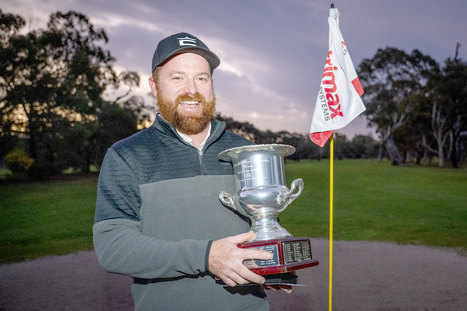 Edward Carracher from the Euroa Golf Club proudly shows off his trophy. PHOTO: ANDREW BERTULEIT