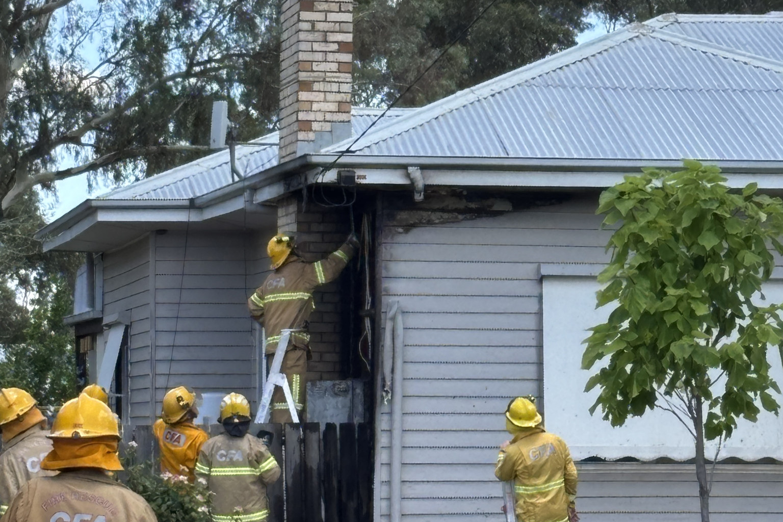 Warracknabeal firefighters removed timber on the fascia and eaves to gain access to the fire. Photo: CAITLIN MENADUE