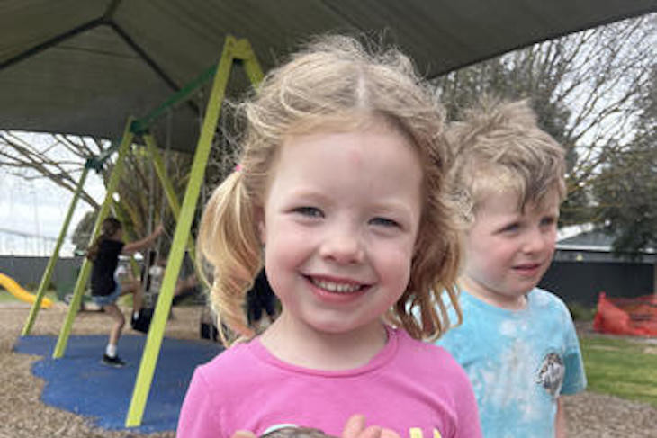 Charlee Hinch, 4, from Horsham with Red the blue tongue lizard. Photo: EMILY FRIEDRICHSEN