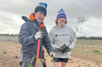 Deputy youth mayor Will Schache, Ryder Reid and Charlie Murray at work at the cemetery. Photo: EMILY FRIEDRICHSEN