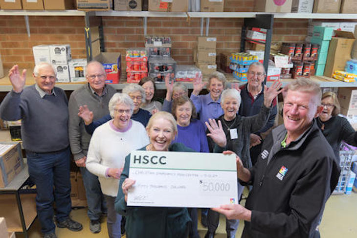 CEFC client assessment manager Bev Miatke and HSCC general manager, Glenn Carroll with volunteers from CEFC receiving their $50,000 cheque.