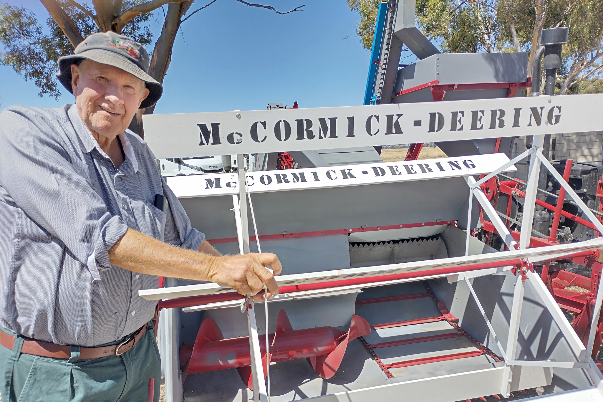 Kalkee farmer Gordon Mills shows the US-made McCormick-Deering combine harvester he owns with Dave Williams of Nhill, believed to be the only one imported to Australia.