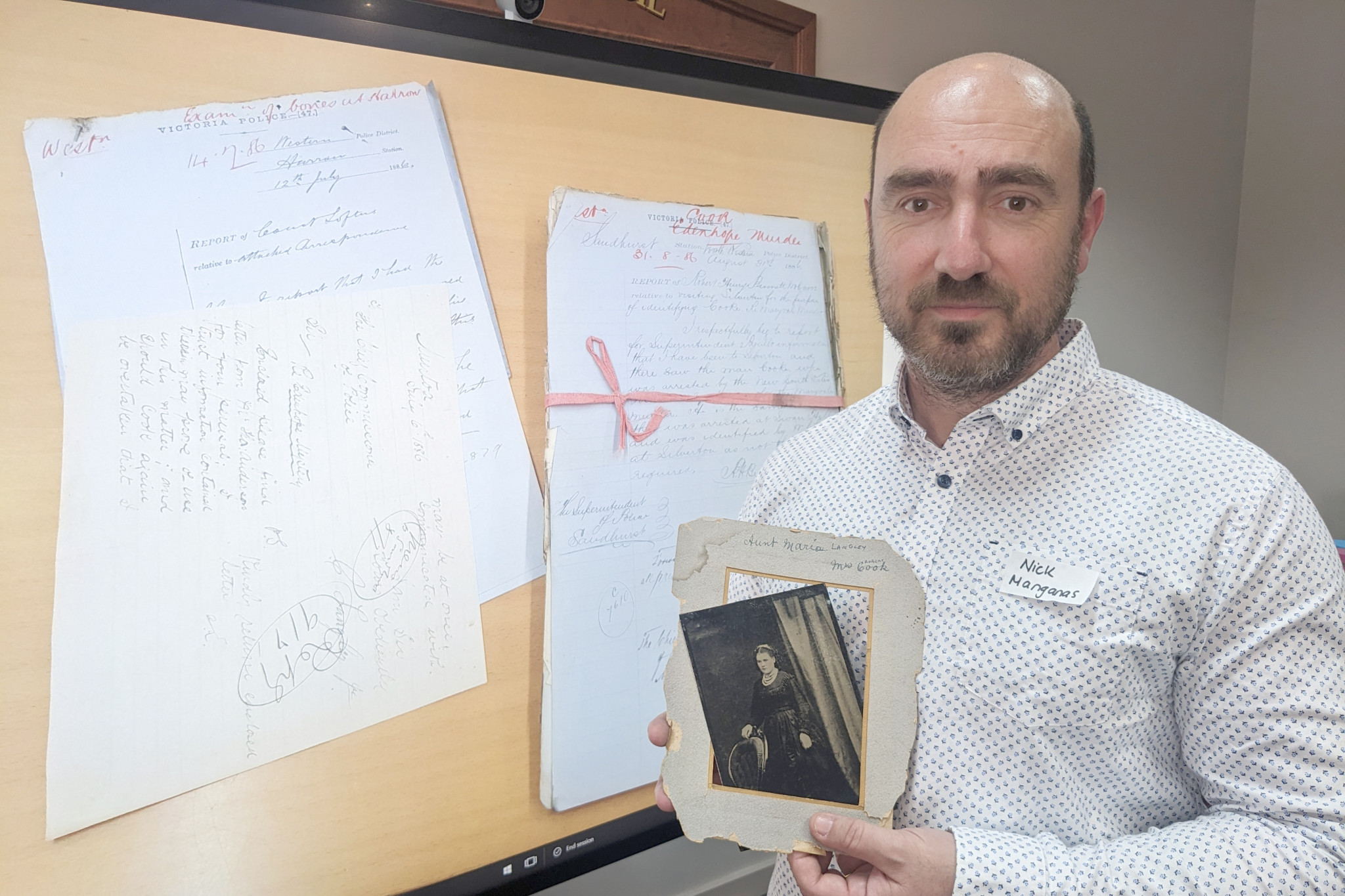 Historian Nick Manganas holds a photograph of Maria Langley Cook.