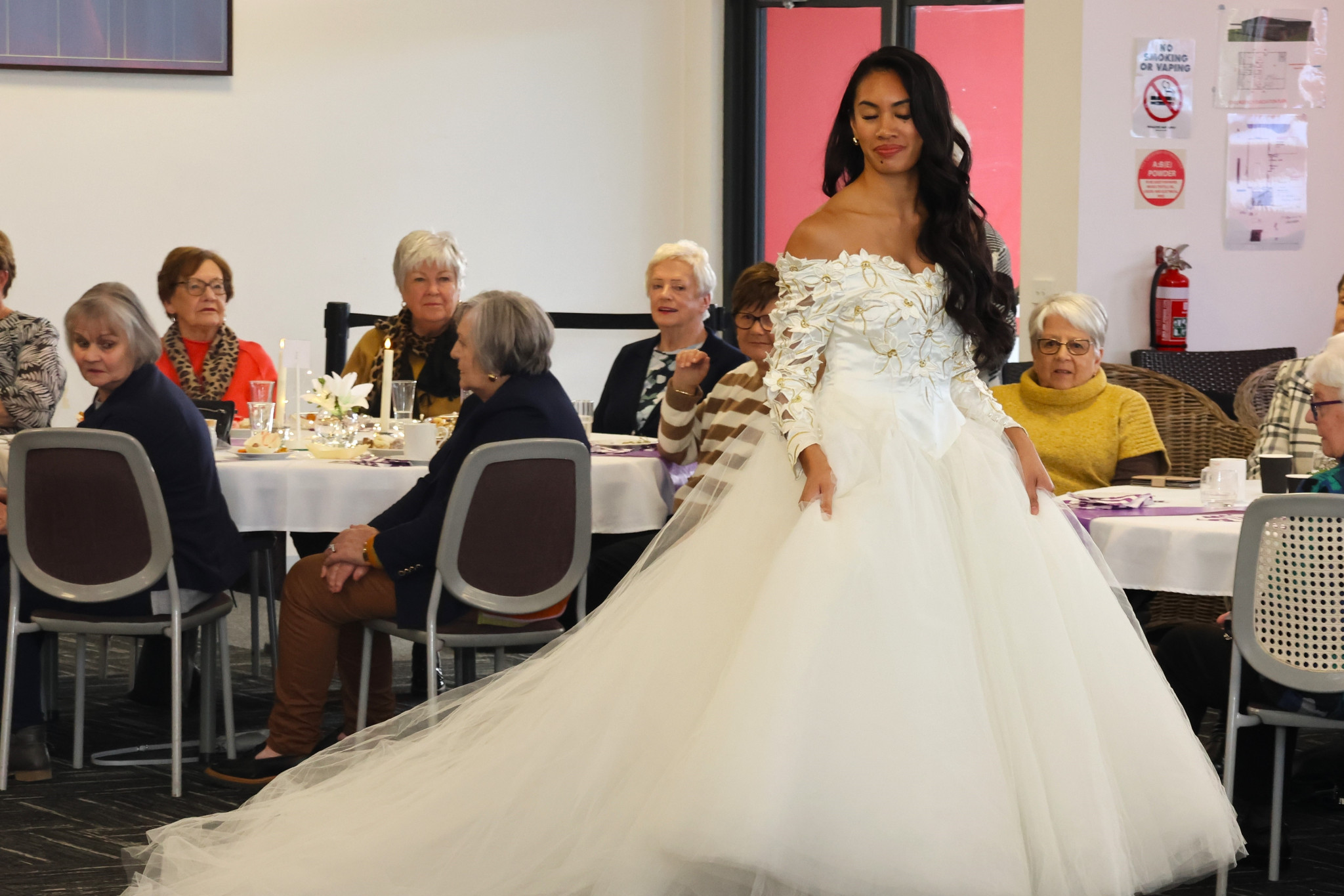 Erica Reinhard models the gown worn by Dione Fisher in 1992.