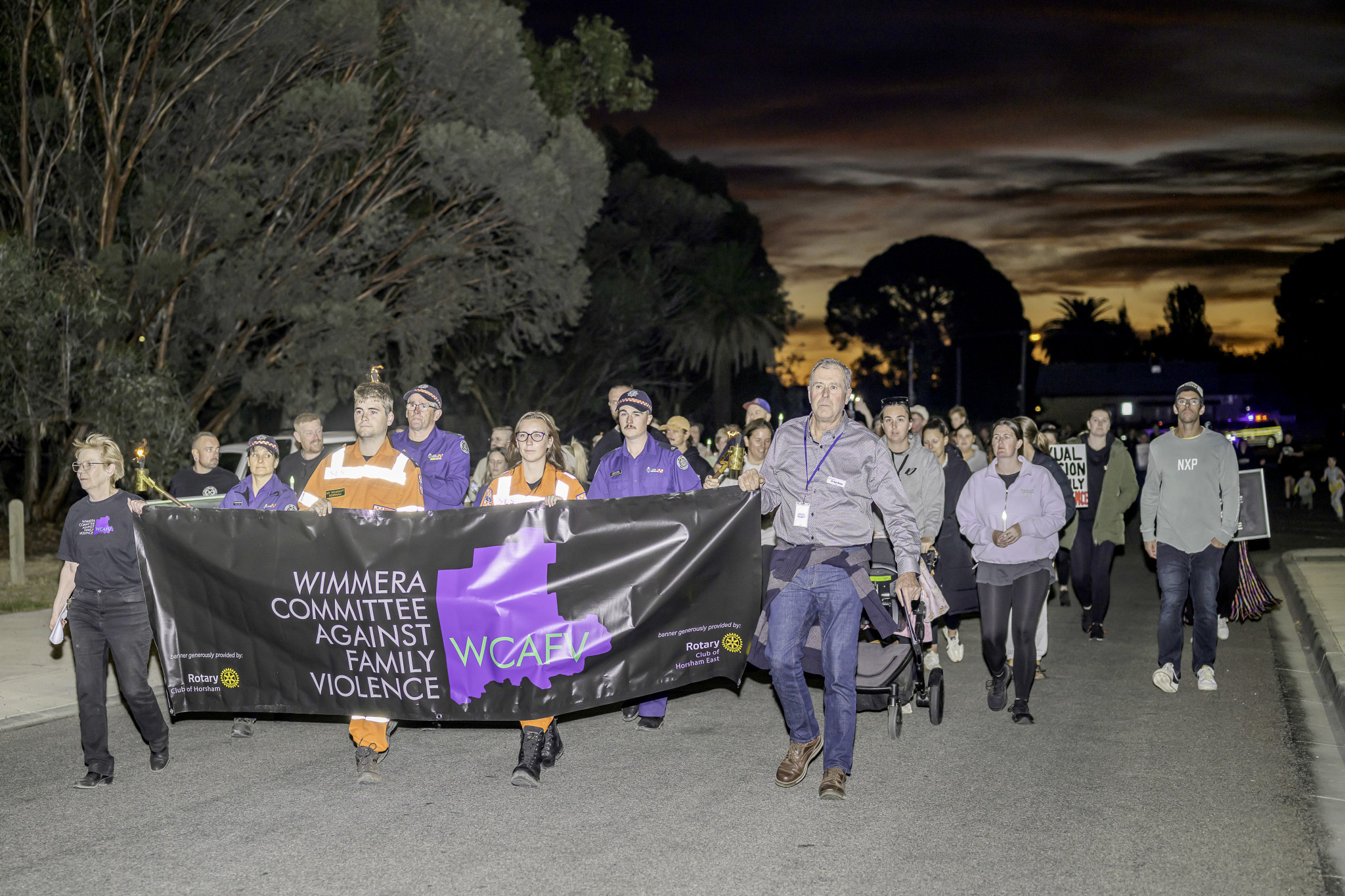 Horsham Rural City Council mayor Ian Ross and other community members participated in the march organised by Wimmera Committee Against Family Violence in Horsham on Sunday evening. Photo: ROBIN WEBB